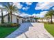 Luxury home with a three-car garage and circular driveway at 15144 Pendio Dr, Montverde, FL 34756