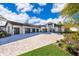 Luxury home with three-car garage and paver driveway at 15144 Pendio Dr, Montverde, FL 34756