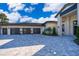 Three-car garage and paver driveway add curb appeal to this stunning property at 15144 Pendio Dr, Montverde, FL 34756