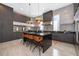Modern kitchen with stainless steel appliances and an island at 15144 Pendio Dr, Montverde, FL 34756