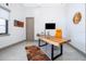 Bright home office featuring a large wood desk and ample natural light at 15144 Pendio Dr, Montverde, FL 34756