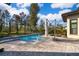 Inviting pool and spa with a spacious patio and lush landscaping at 15144 Pendio Dr, Montverde, FL 34756