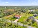 Aerial view of house, large yard, and surrounding landscape at 19206 Robertson St, Orlando, FL 32833