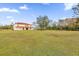 Spacious backyard with a view of the house and plenty of green space at 19206 Robertson St, Orlando, FL 32833