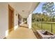 Covered patio with outdoor kitchen, fire pit, and access to the house at 19206 Robertson St, Orlando, FL 32833