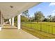 Large covered patio with built-in grill and expansive views of the fenced backyard at 19206 Robertson St, Orlando, FL 32833