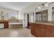 Luxurious bathroom with double vanity, soaking tub, and walk-in closet at 19206 Robertson St, Orlando, FL 32833