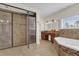 Large bathroom with a shower, soaking tub, and double vanity at 19206 Robertson St, Orlando, FL 32833
