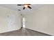 Spacious bedroom with neutral walls and carpet, featuring a large closet and an additional doorway at 19206 Robertson St, Orlando, FL 32833