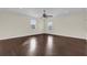 Main bedroom with hardwood floors and ceiling fan at 19206 Robertson St, Orlando, FL 32833