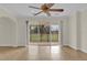 Gathering room with sliding doors leading to backyard at 19206 Robertson St, Orlando, FL 32833