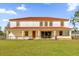 Two-story house with terracotta tile roof and a large backyard at 19206 Robertson St, Orlando, FL 32833