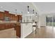 Kitchen with wood cabinets, island, and view to Gathering room at 19206 Robertson St, Orlando, FL 32833