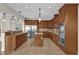 Island kitchen featuring stainless steel appliances and dark wood cabinets at 19206 Robertson St, Orlando, FL 32833