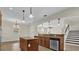 Open kitchen with large island, stainless steel appliances, and breakfast bar at 19206 Robertson St, Orlando, FL 32833