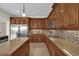 Eat-in kitchen with stainless steel appliances and granite countertops at 19206 Robertson St, Orlando, FL 32833