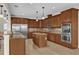 Modern kitchen with island, stainless steel appliances, and granite countertops at 19206 Robertson St, Orlando, FL 32833