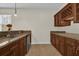 Kitchenette with wood cabinets and stainless steel appliances at 19206 Robertson St, Orlando, FL 32833
