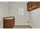 Laundry room with built-in cabinets and a utility sink at 19206 Robertson St, Orlando, FL 32833