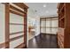 Spacious walk-in closet, custom built-ins, and dark hardwood floors at 19206 Robertson St, Orlando, FL 32833