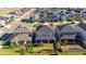 Aerial view of a residential neighborhood with focus on a house and its backyard at 2695 Plume Rd, Clermont, FL 34711