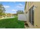 Backyard with pond view and white fence at 3006 Seaview Castle Dr, Kissimmee, FL 34746