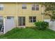 Private backyard with grassy area and sliding glass door access at 3006 Seaview Castle Dr, Kissimmee, FL 34746