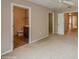 Primary bedroom with carpet, ceiling fan and access to bathroom at 3006 Seaview Castle Dr, Kissimmee, FL 34746