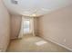 Spacious bedroom with ceiling fan and carpeted floors at 3006 Seaview Castle Dr, Kissimmee, FL 34746