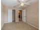Bright bedroom featuring ceiling fan and roomy closet at 3006 Seaview Castle Dr, Kissimmee, FL 34746