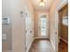 Tiled entryway with coat closet and half bathroom at 3006 Seaview Castle Dr, Kissimmee, FL 34746