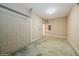Garage with concrete floor, block walls, and extra storage at 3006 Seaview Castle Dr, Kissimmee, FL 34746
