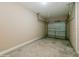 Empty garage with overhead storage and an open garage door at 3006 Seaview Castle Dr, Kissimmee, FL 34746