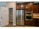 Kitchen features stainless steel appliances and ample wood cabinetry at 3006 Seaview Castle Dr, Kissimmee, FL 34746