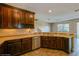 Kitchen with dark wood cabinets, granite countertops and stainless steel appliances at 3006 Seaview Castle Dr, Kissimmee, FL 34746