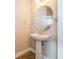 Small pedestal sink and toilet in a half bathroom at 3006 Seaview Castle Dr, Kissimmee, FL 34746
