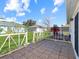 Backyard patio with tile flooring and white railings at 552 Eagle Ct, Poinciana, FL 34759