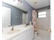 Bathroom features double vanity and shower/tub combo at 552 Eagle Ct, Poinciana, FL 34759