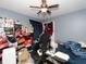 Bedroom with ceiling fan, dresser, and lots of storage at 552 Eagle Ct, Poinciana, FL 34759