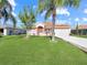 Charming one-story house with lush landscaping and palm trees at 552 Eagle Ct, Poinciana, FL 34759