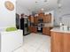 Modern kitchen with stainless steel appliances and wood cabinets at 552 Eagle Ct, Poinciana, FL 34759