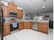 Updated kitchen featuring stainless steel appliances and ample counter space at 552 Eagle Ct, Poinciana, FL 34759