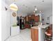 Modern kitchen with wood cabinets, stainless steel appliances, and an island at 552 Eagle Ct, Poinciana, FL 34759