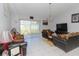 Living Room with two brown sofas and a large TV at 552 Eagle Ct, Poinciana, FL 34759