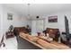 Living room with two brown sofas and sliding doors at 552 Eagle Ct, Poinciana, FL 34759