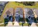 Modern house with solar panels and a backyard pool, viewed from above at 8956 Hilton Ridge Ave, Kissimmee, FL 34747
