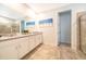 Spa-like bathroom featuring double vanity and walk-in shower at 8956 Hilton Ridge Ave, Kissimmee, FL 34747