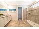 Modern bathroom with double vanity and large walk-in shower at 8956 Hilton Ridge Ave, Kissimmee, FL 34747