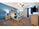 Main bedroom with a king-size bed and en-suite bathroom at 8956 Hilton Ridge Ave, Kissimmee, FL 34747
