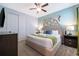 Comfortable guest bedroom with a king-size bed and ample closet space at 8956 Hilton Ridge Ave, Kissimmee, FL 34747